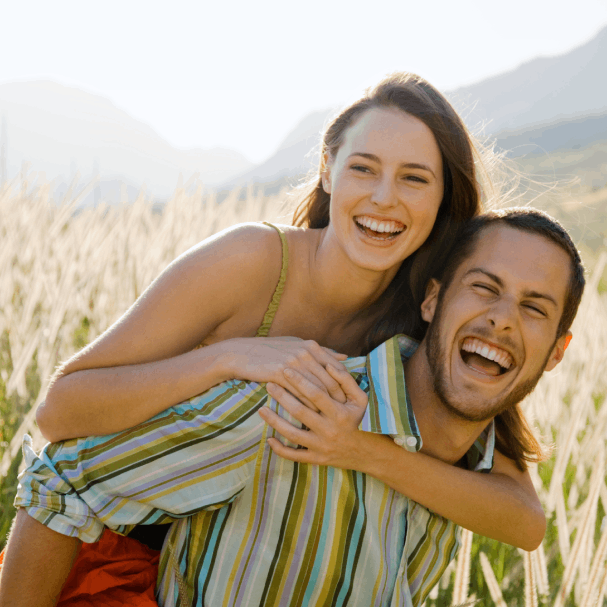 Joyful couple in a wheat field